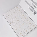 Intérieur du Calendrier de l’Avent 2025 Gemology avec 24 cases numérotées à ouvrir chaque jour de décembre